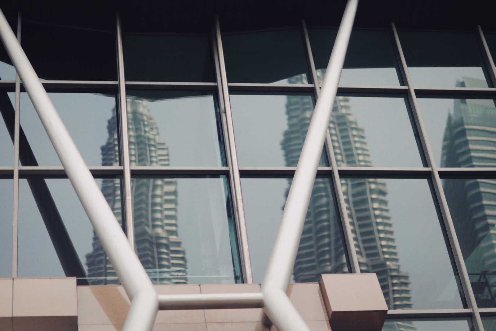 The Petronas Towers seen through an office window in Kuala Lumpur